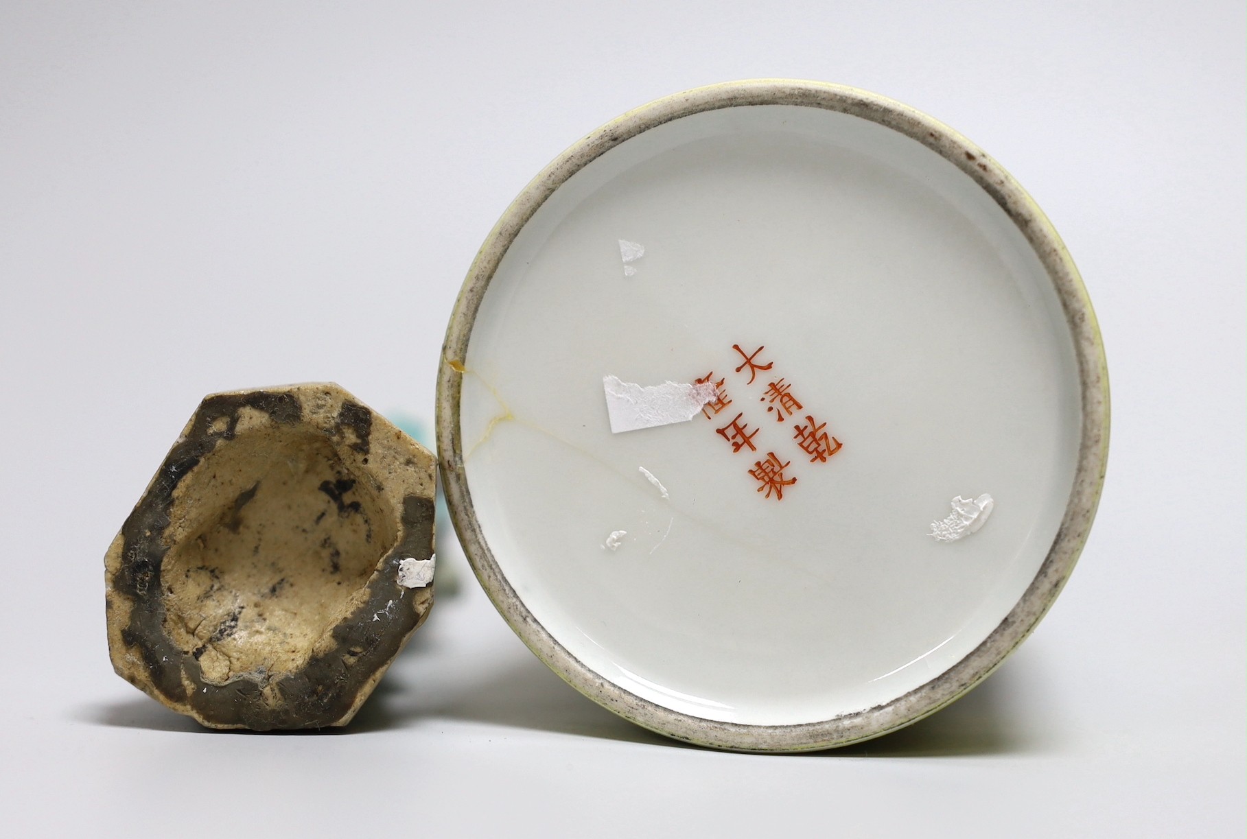 A Chinese yellow ground cylindrical brush pot, Republic period and a Jiaqing famille rose figure of a deity, tallest 16cm